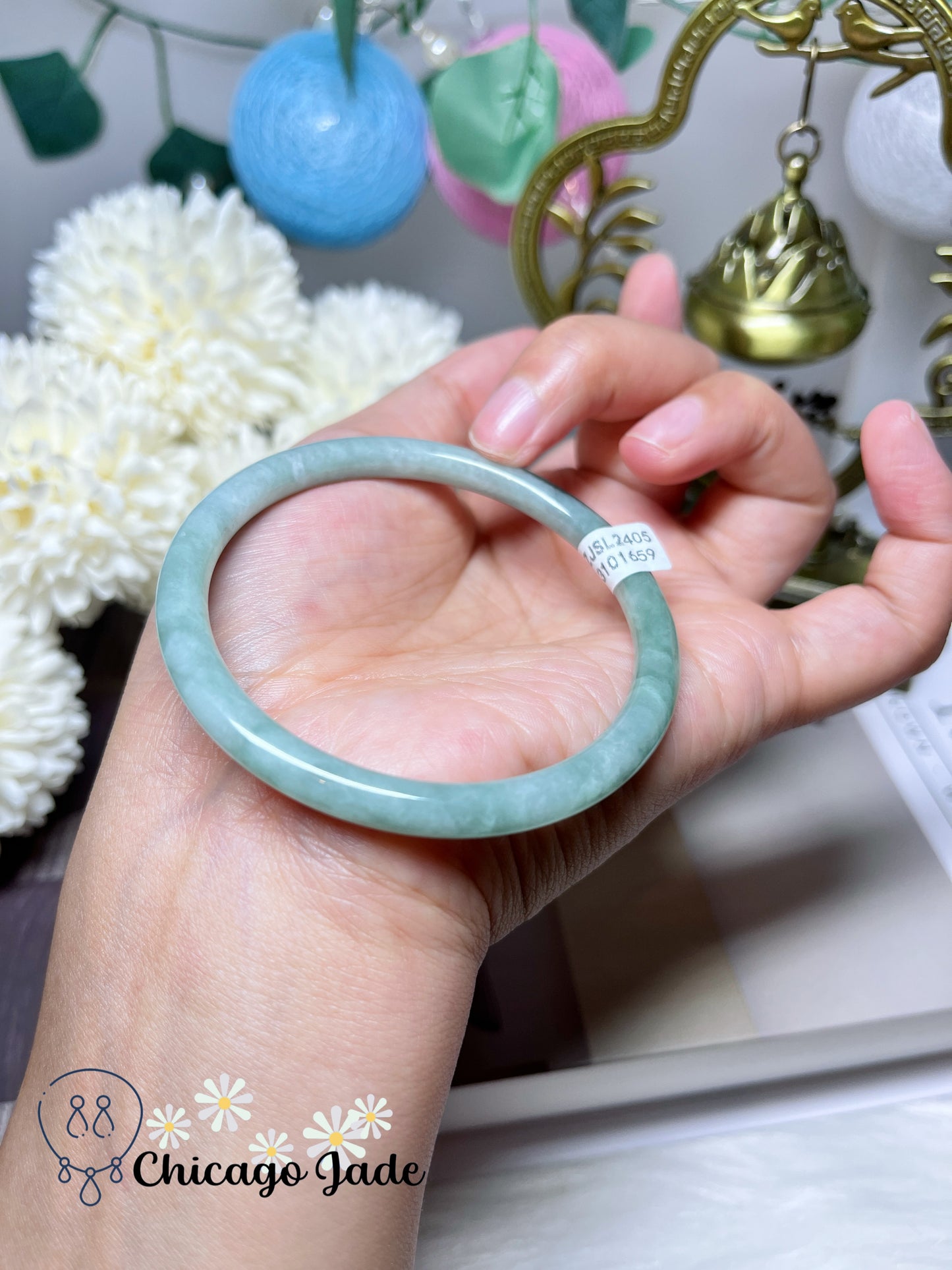 56mm Size M Light Green Round Jadeite Jade Bangle with Touches of Darker Green