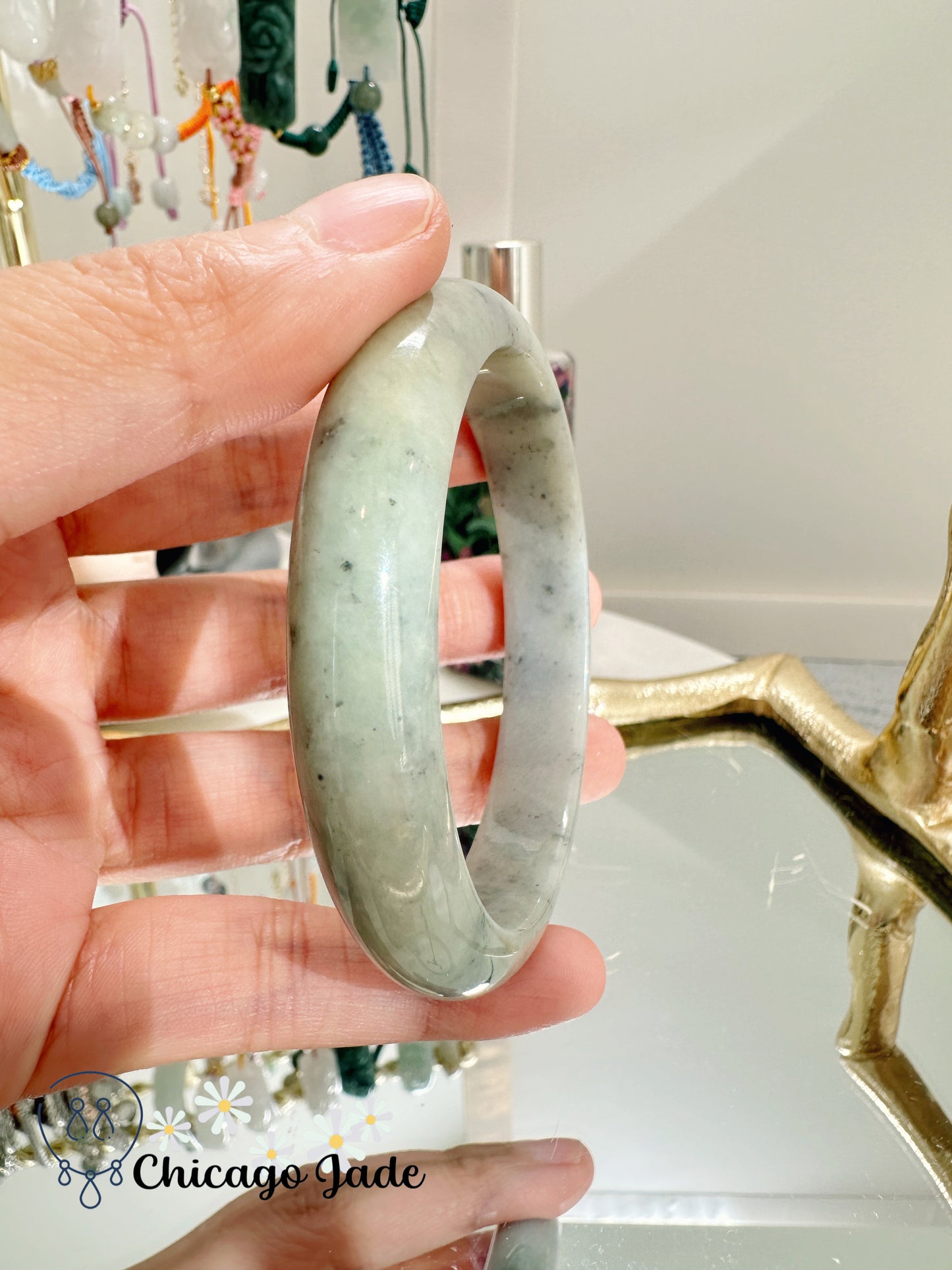 Light green base with dark dots like sesame seeds jadeite jade bangle - size M authentic with certificate