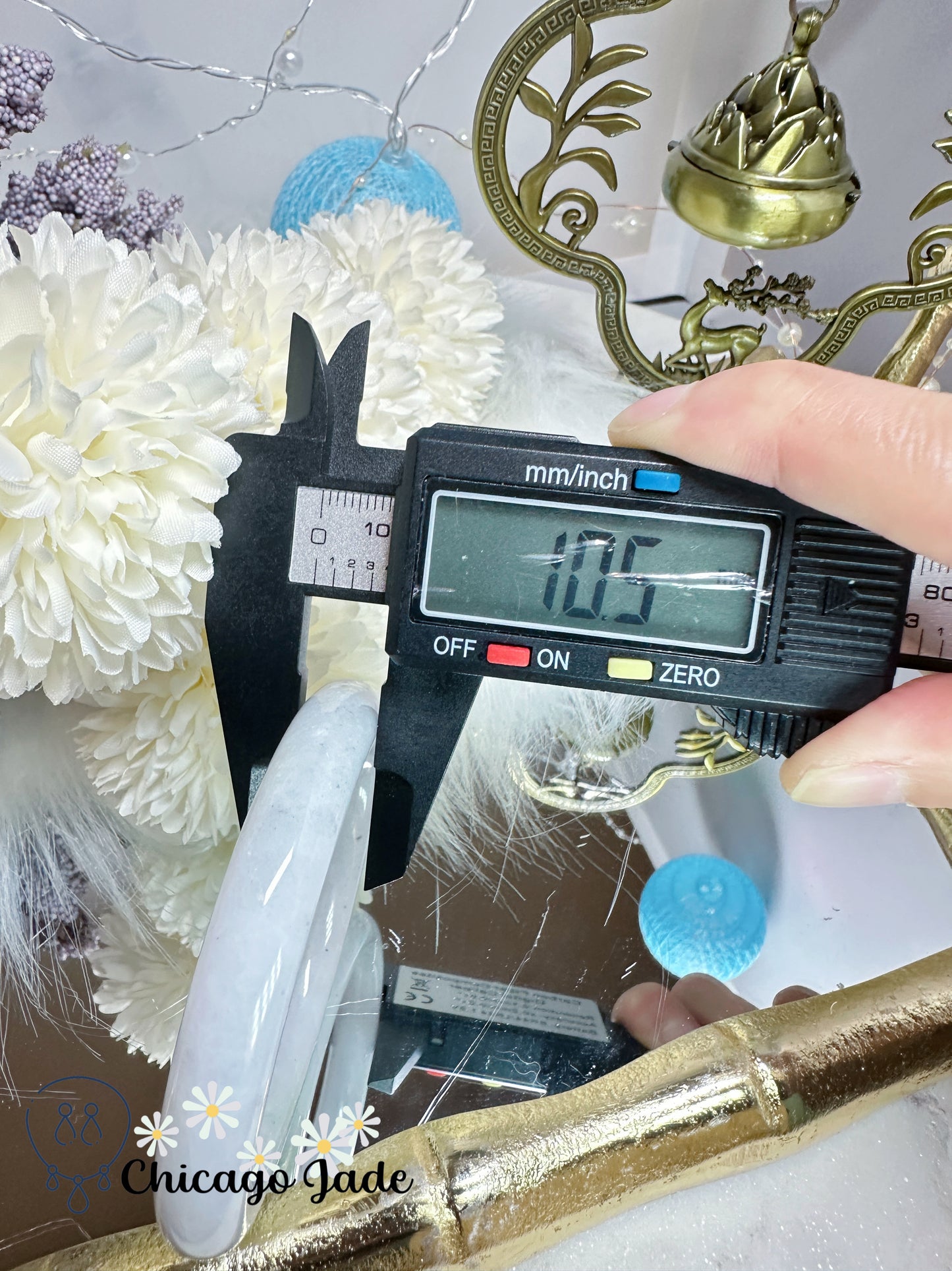 55.3mm Moonlight white with touches of wuji dark spots and green flower natural untreated Burma jadeite jade feicui bangle