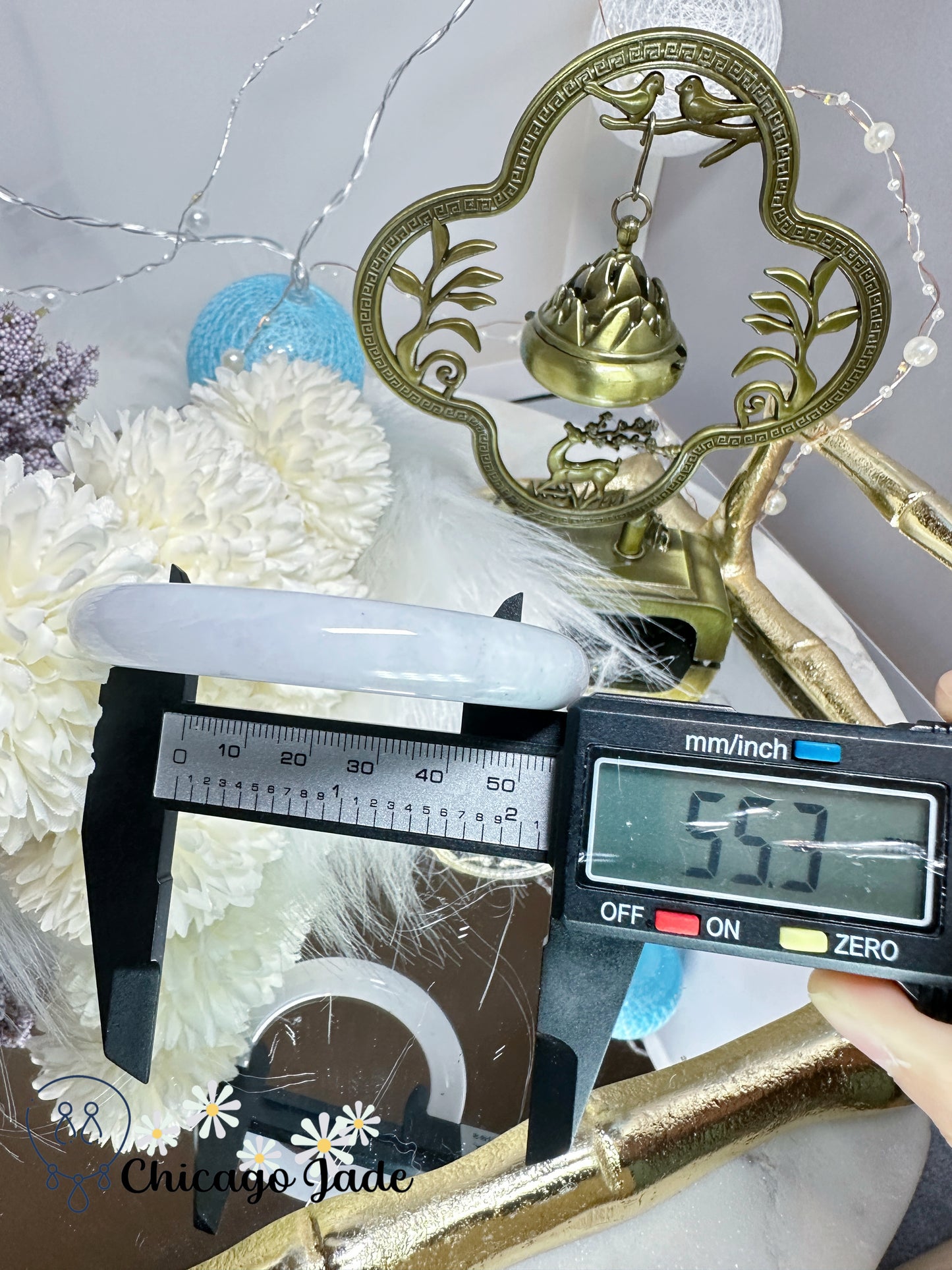 55.3mm Moonlight white with touches of wuji dark spots and green flower natural untreated Burma jadeite jade feicui bangle