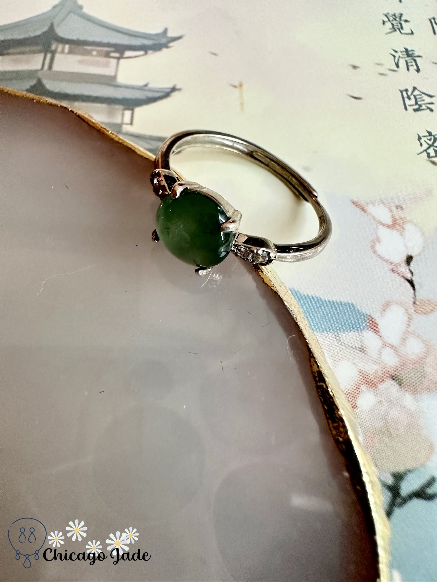 Bluish green main jadeite on sterling silver ring with zircon